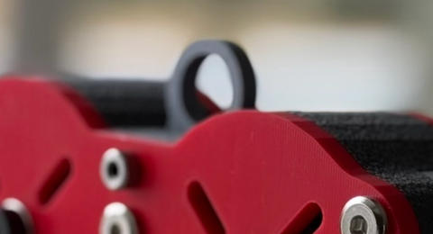 Mach 1 top hook add-on mounted above the red Zip-Rush trolley